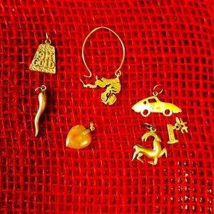 14k gold And 10k. Some Stamped some not. Beautiful Charms Neclace Or Braclate.